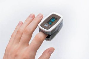 Discover the essential components of a pulse oximeter and how they monitor oxygen saturation in the blood efficiently.